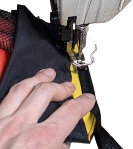 Manually folding over binding tape